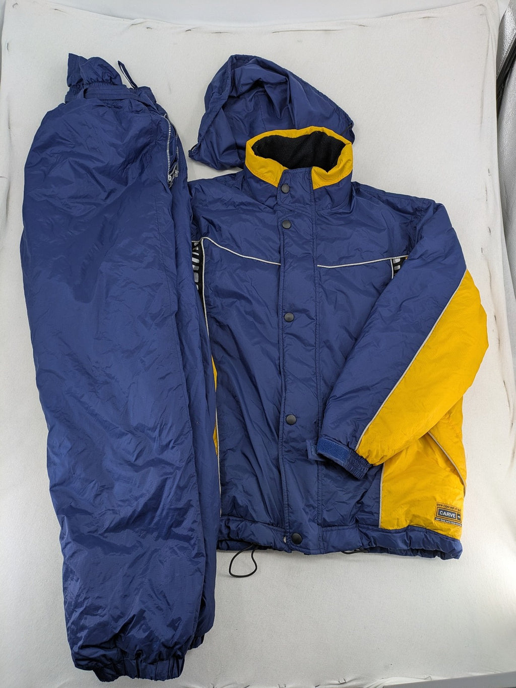 Shamp navy and yellow vintage ski jacket and pants set with retro design.