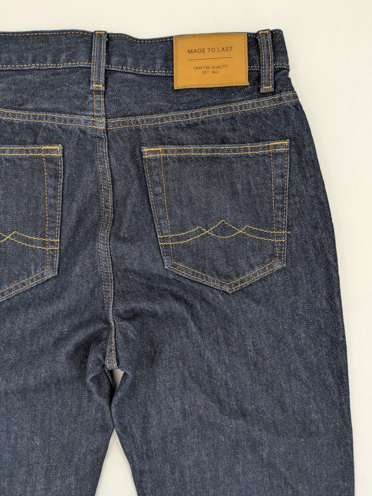 C&A blue straight jeans W28 L32 with 5-pocket design and contrasting orange stitching.