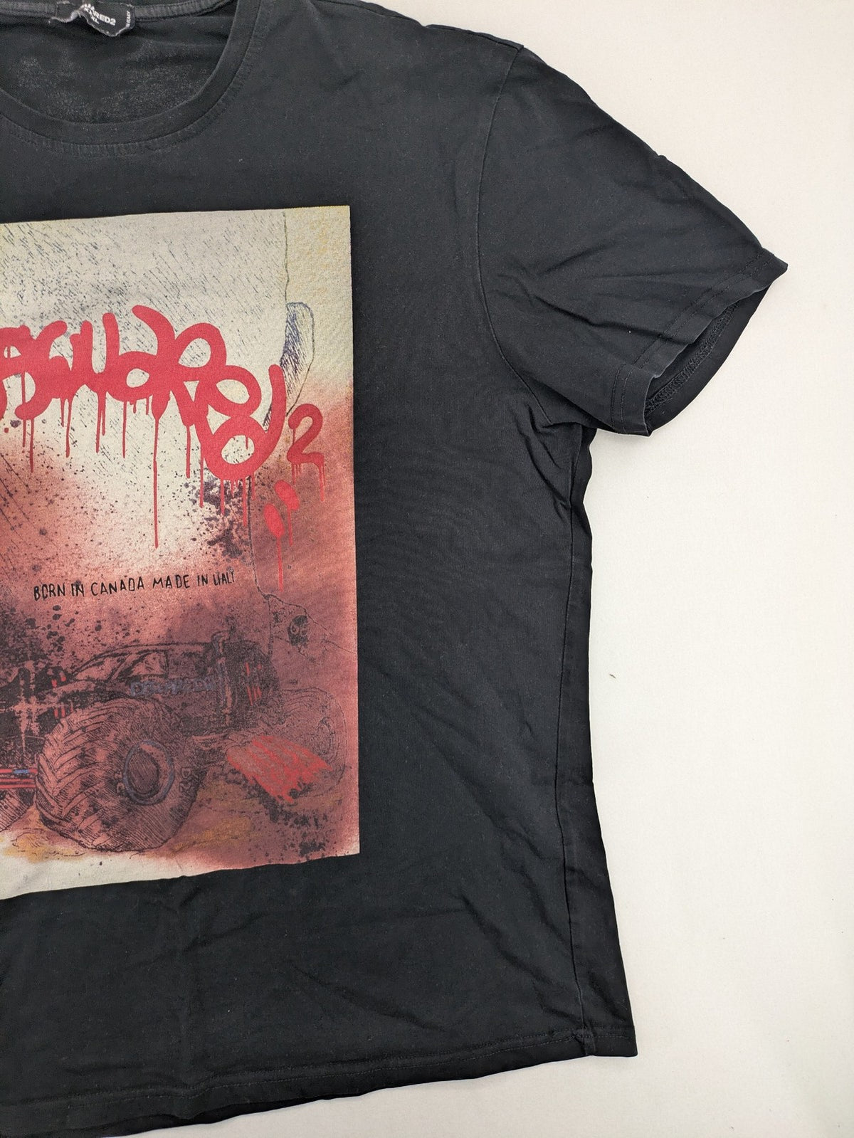 Dsquared2 multi graphic t-shirt featuring bold monstertruck print and graffiti-style logo.