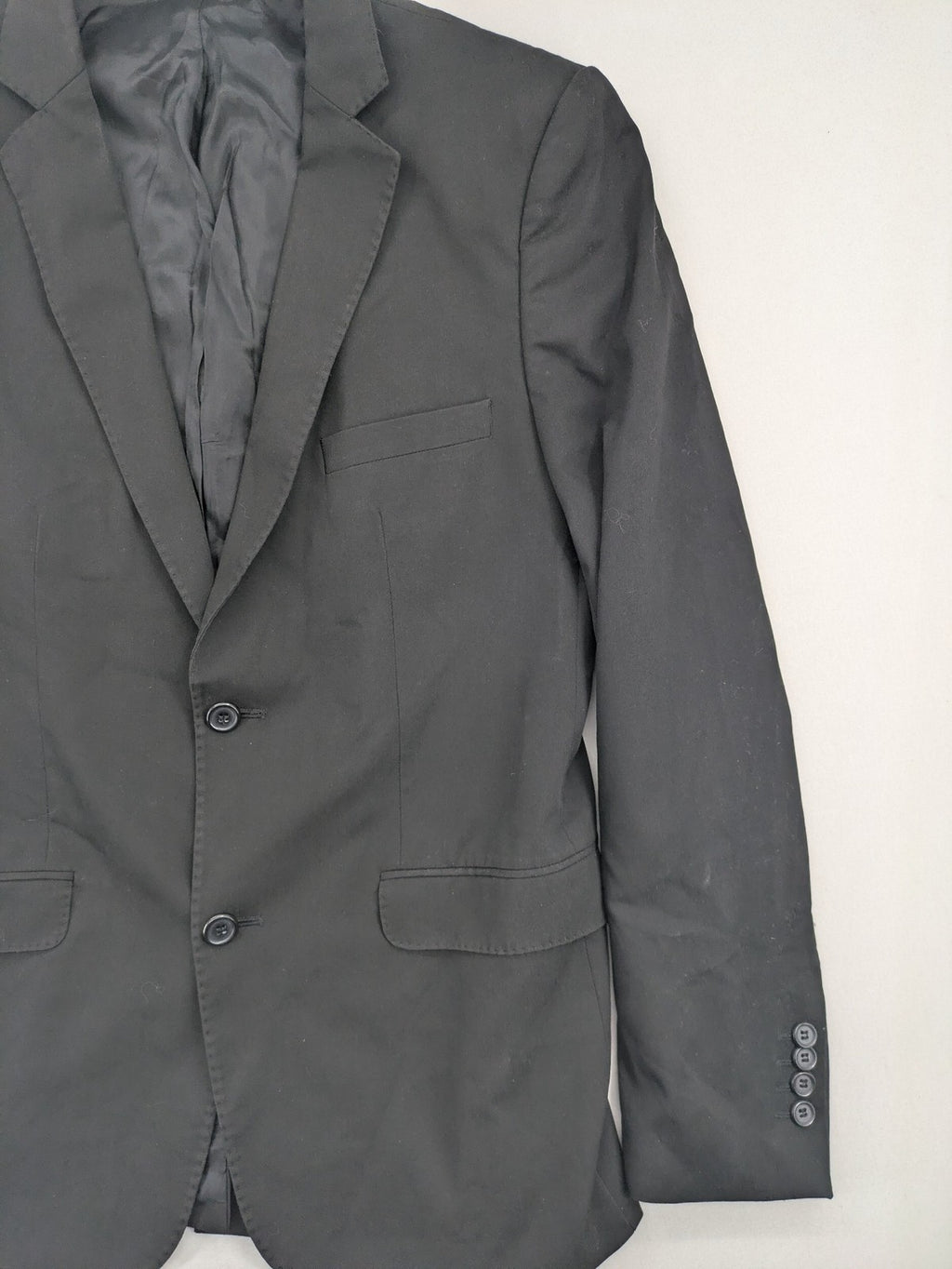 Zara Man grey blazer two-button design with structured silhouette and smooth lining.