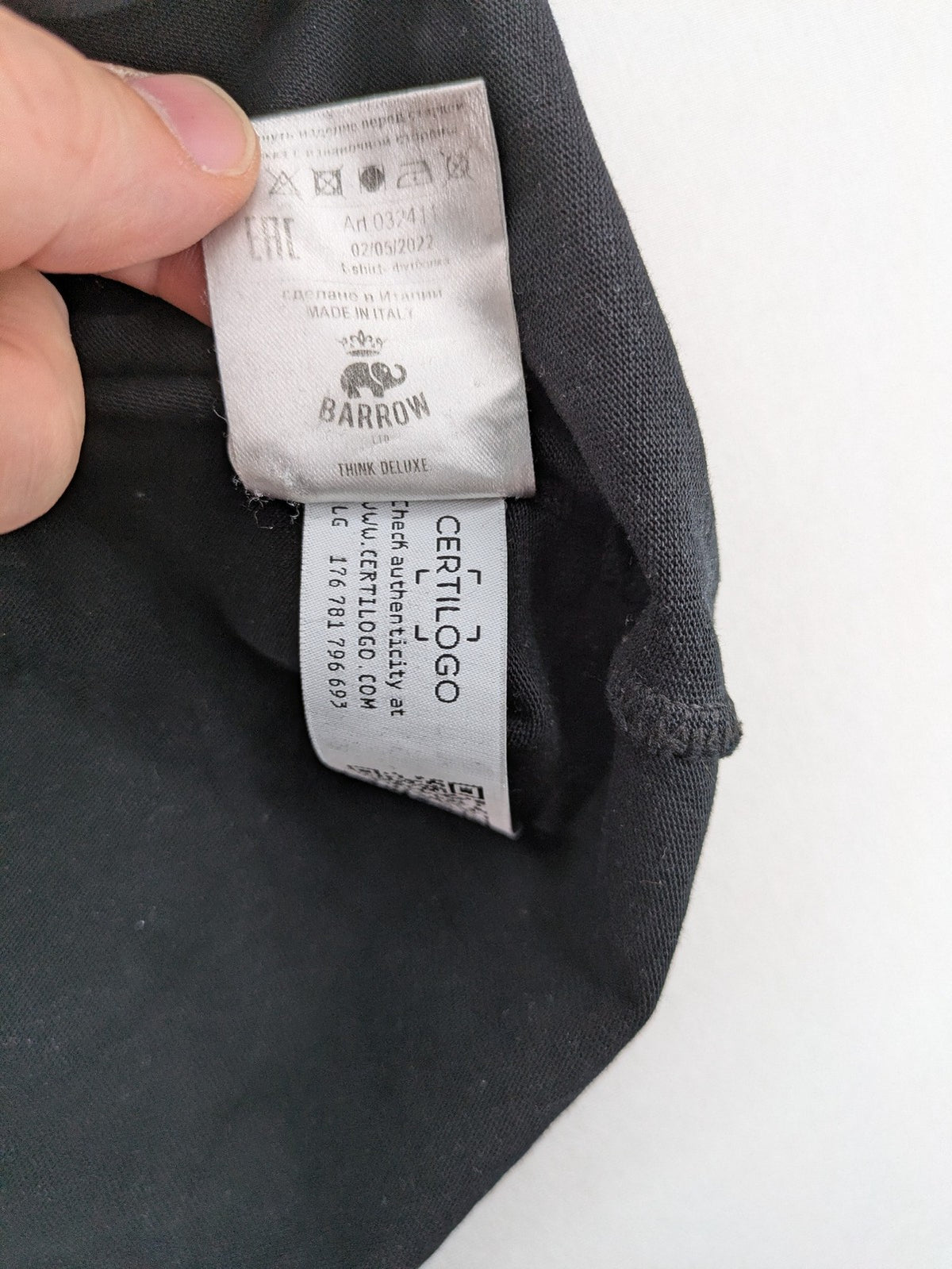 Barrow grey t-shirt with large black and white smiley graphic print and logo patch.