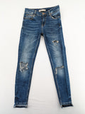 Zara Basic blue skinny jeans with destroyed knee details and frayed hem.