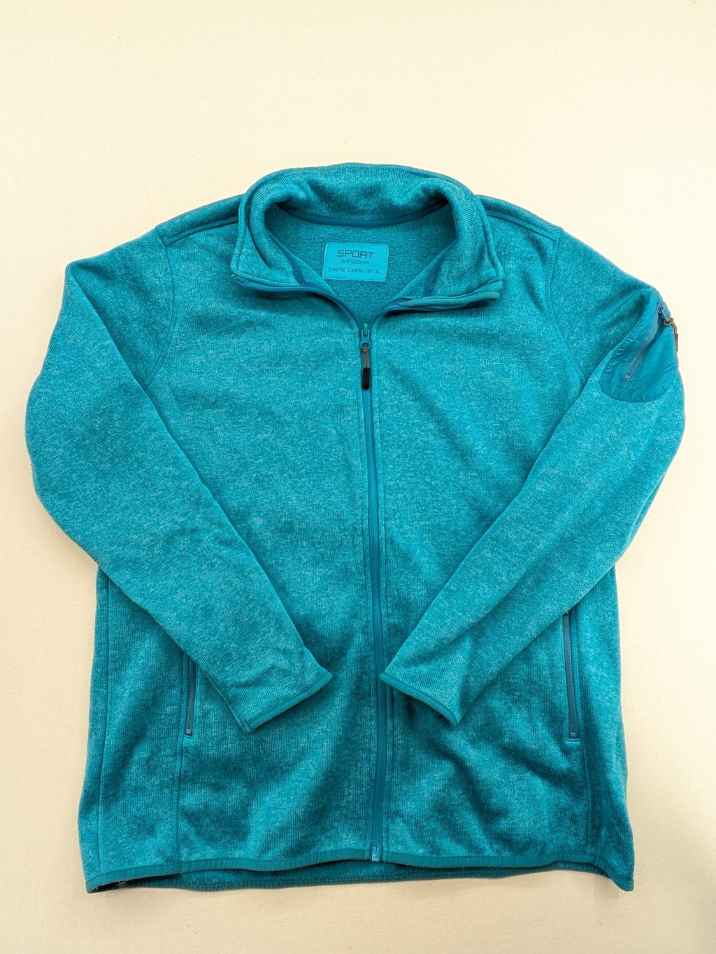 Stooker blue and turquoise fleece jacket with full zip and stand-up collar.