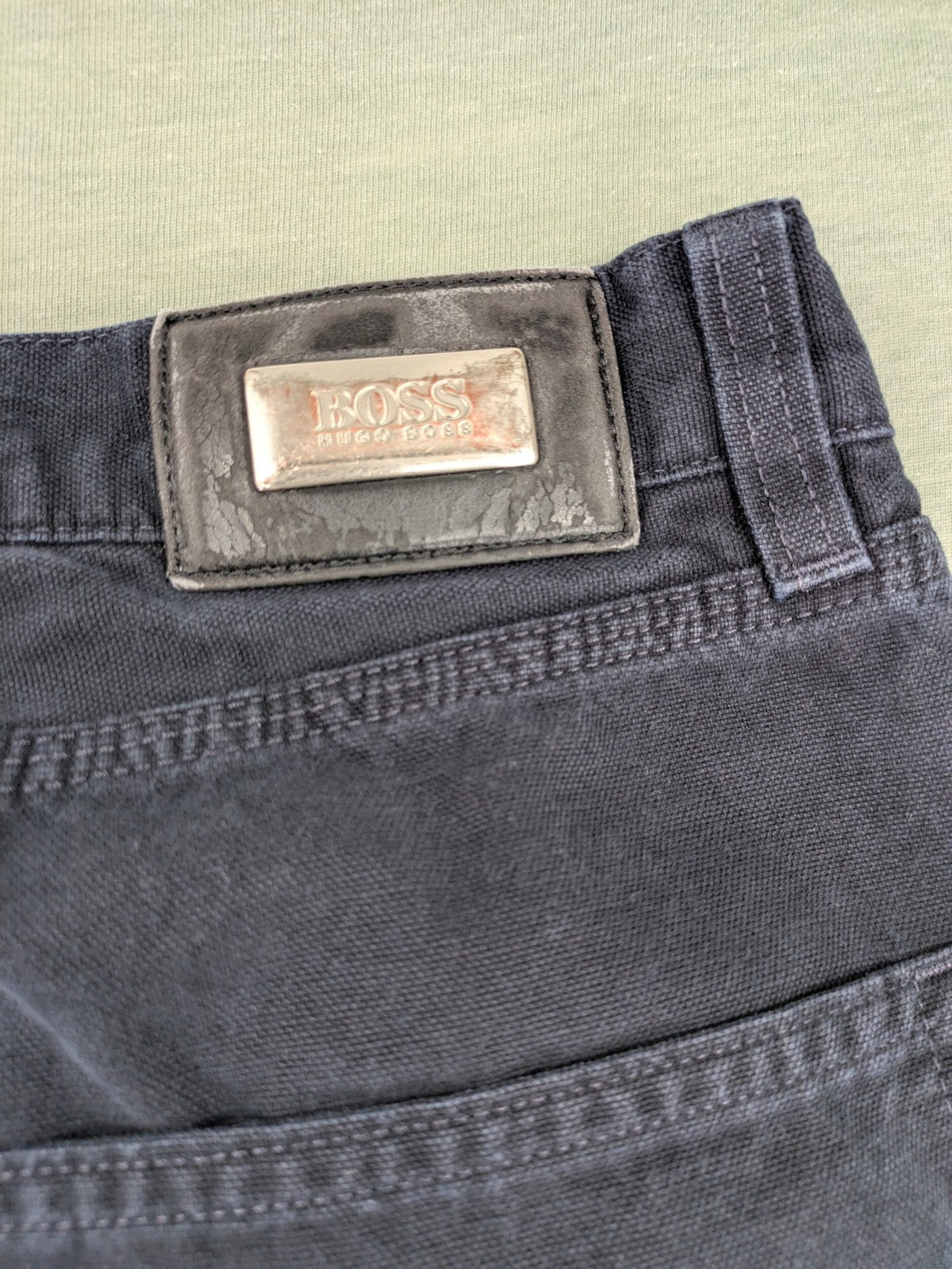 BOSS Hugo Boss grey straight jeans classic 5-pocket design with leather patch.