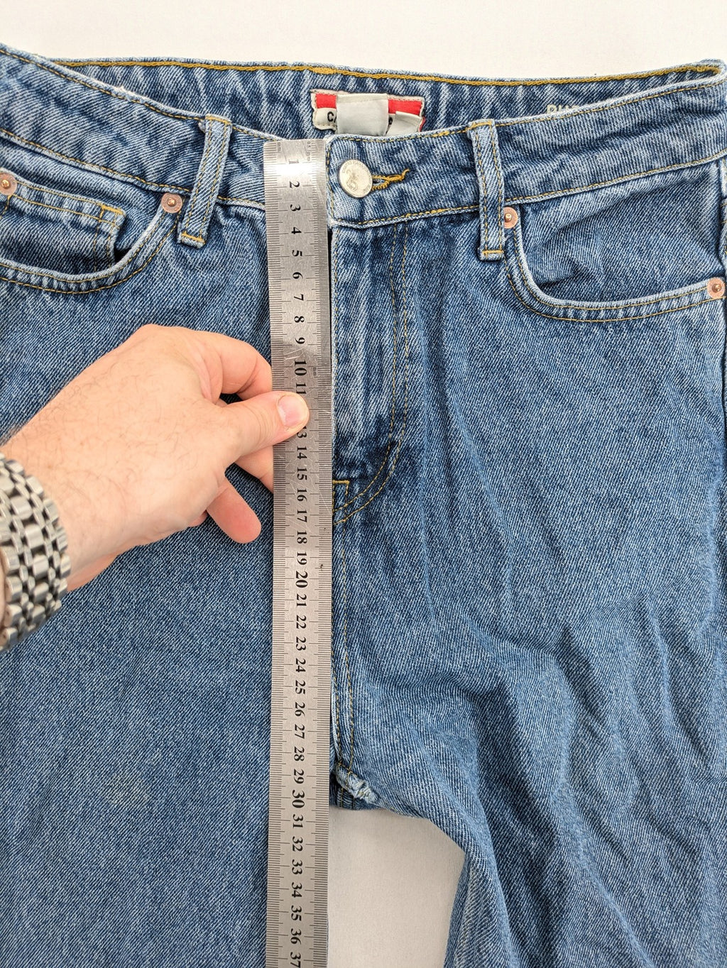 Castro Jeans blue straight leg jeans high waist with white paint splatter details.