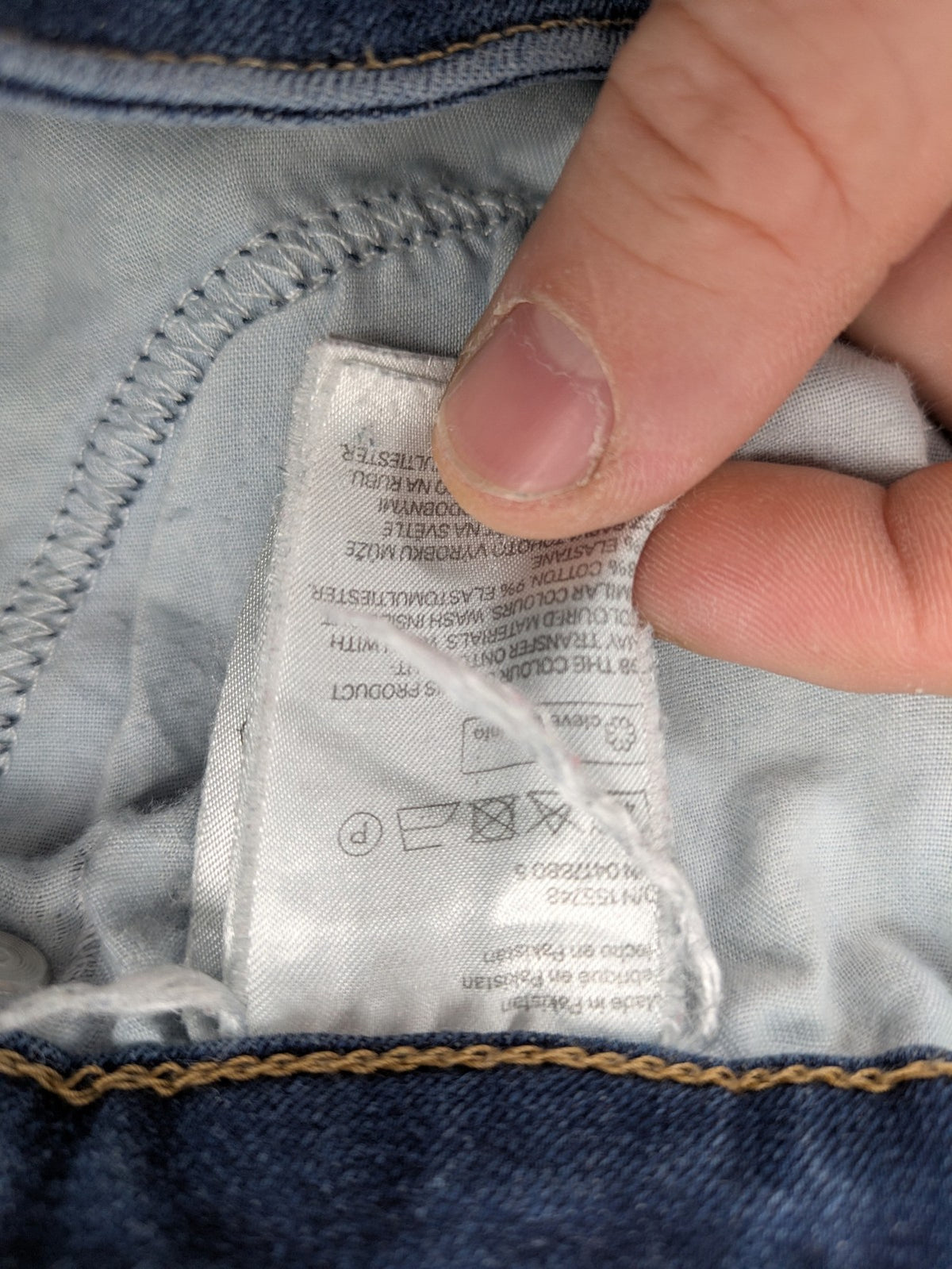 H&M blue skinny jeans with distressed details and comfortable stretch denim material.