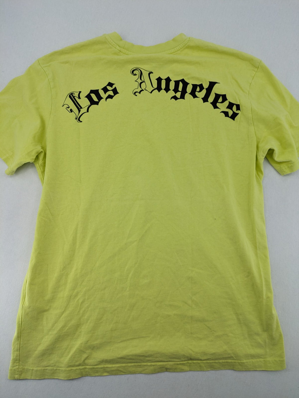 Primark yellow band t-shirt featuring Gothic LA graphic print and "PRESENT" patch.