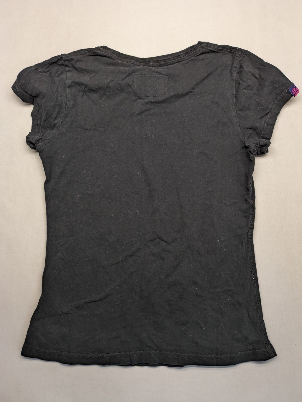 Superdry black t-shirt with large Osaka Brand logo and subtle floral pattern.