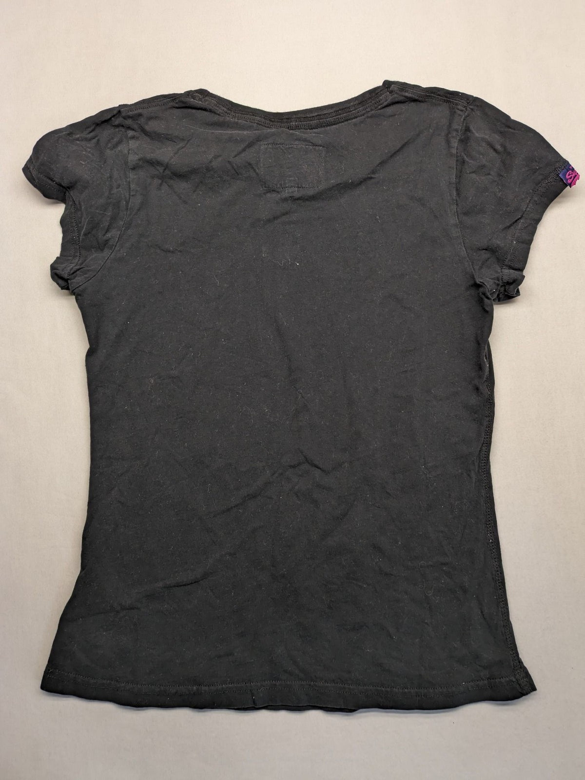 Superdry black t-shirt with large Osaka Brand logo and subtle floral pattern.