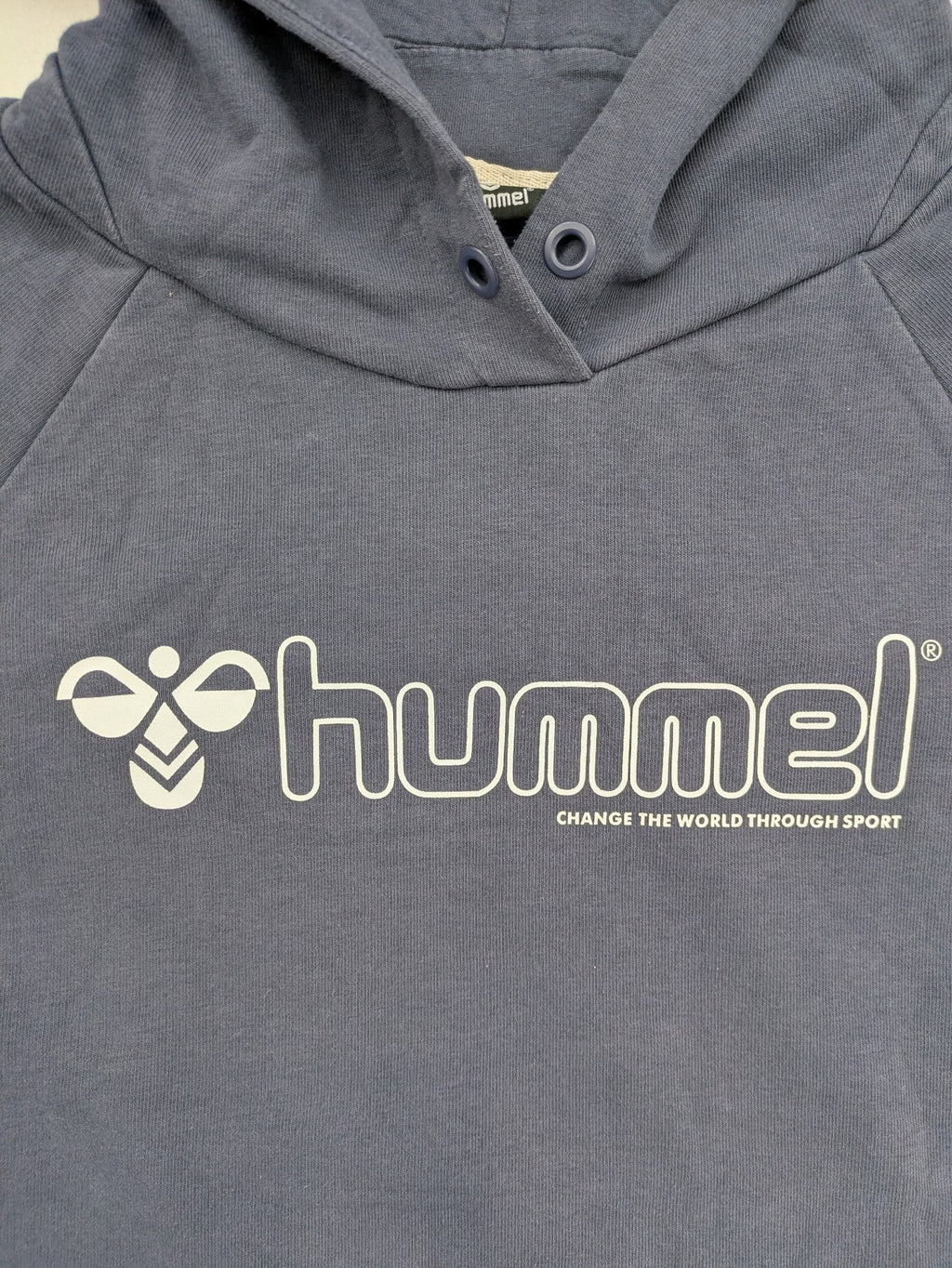 Hummel grey turtle neck jumper featuring large logo, kangaroo pocket, cotton blend material.