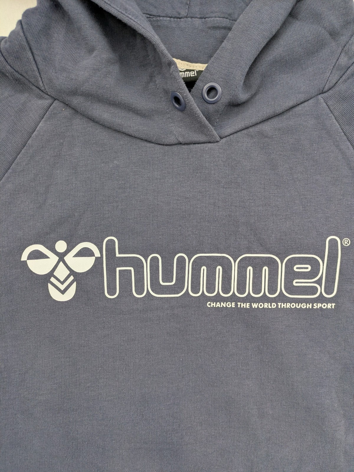 Hummel grey turtle neck jumper featuring large logo, kangaroo pocket, cotton blend material.