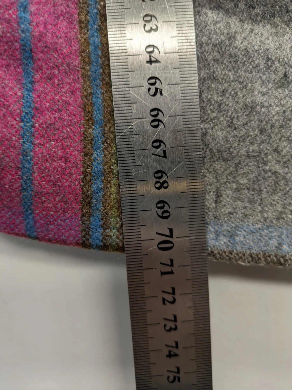 Johnnie B pink coat with gray check pattern, Sherpa lining, and zip closure.