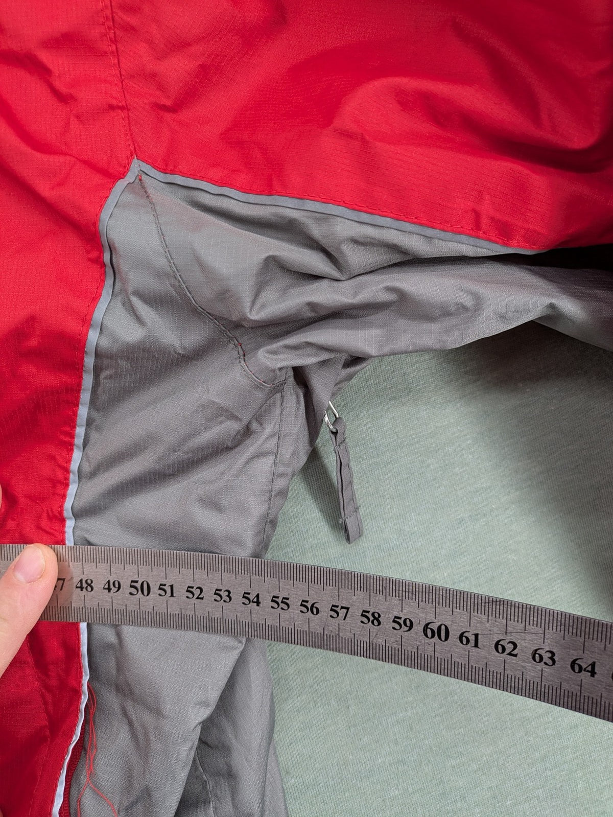 Movement Session grey and red windbreaker jacket with colorblock pattern and full zip.