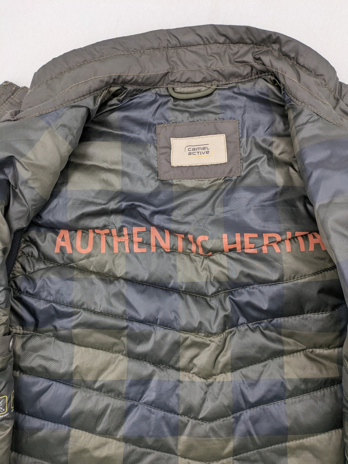 Camel Active khaki vest with full zip, quilted design, checkered lining, water-resistant.