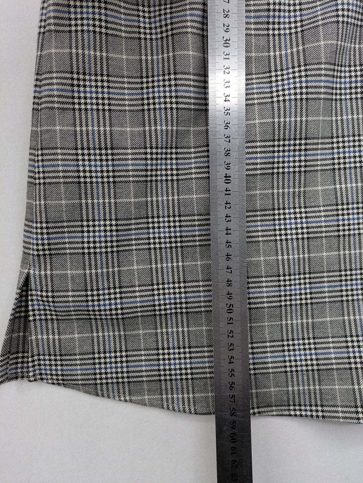 Zara ruffled sleeveless blouse grey check pattern high ruffle collar with blue, black, white accents