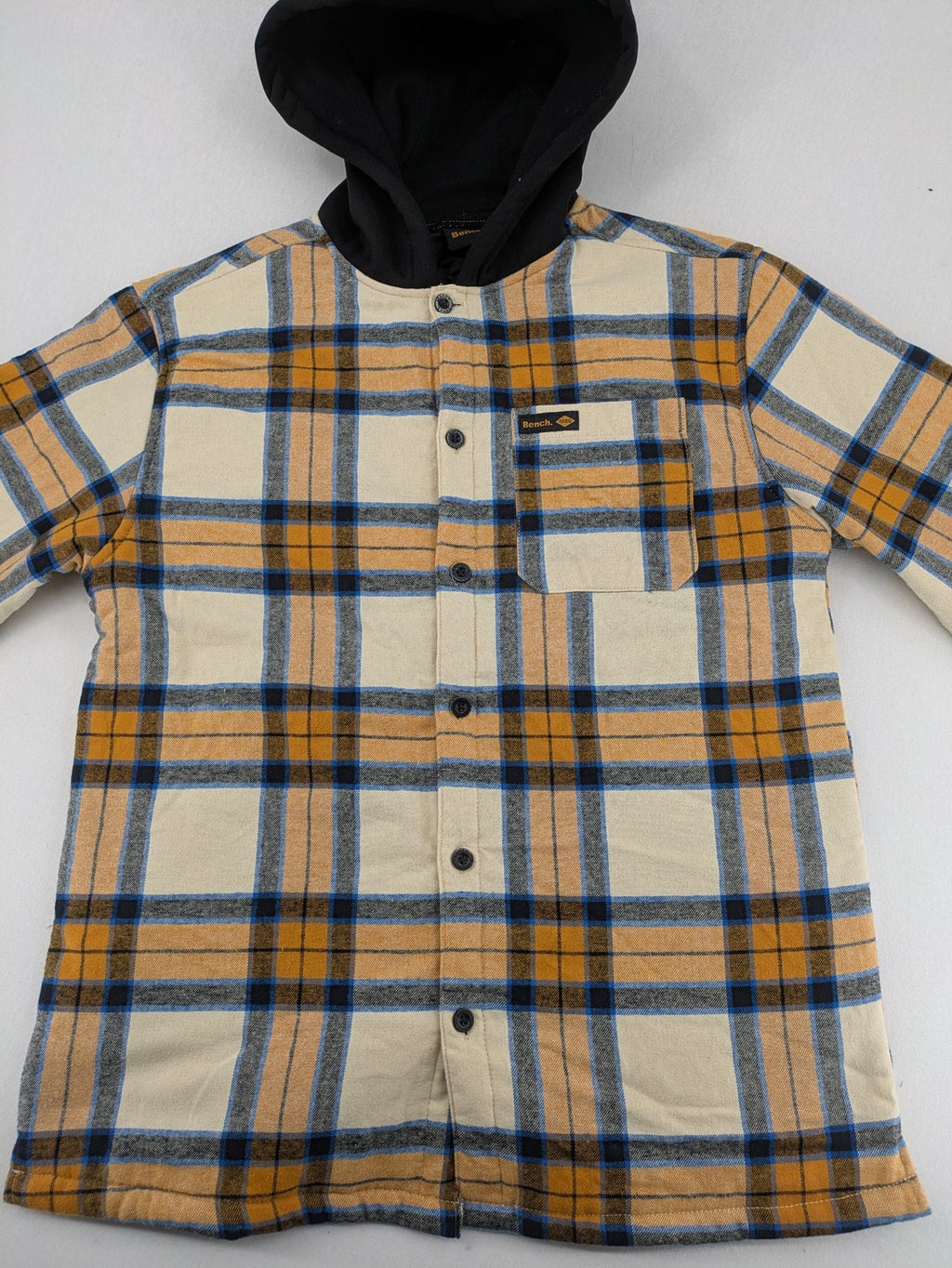 Bench cream flannel jacket with check pattern, black hood, and button placket.