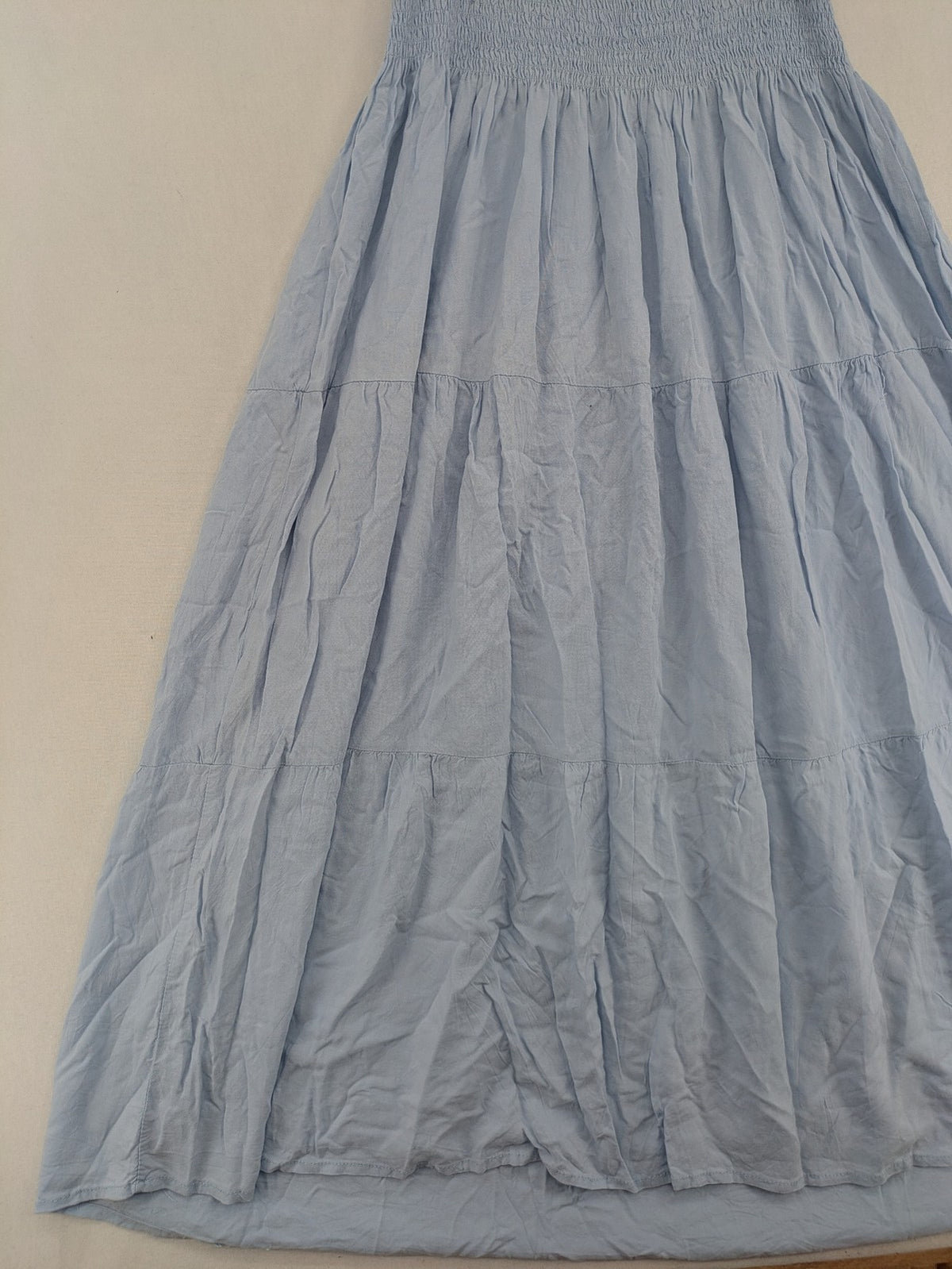 Ebelove blue summer dress with smocked bodice and adjustable spaghetti straps.