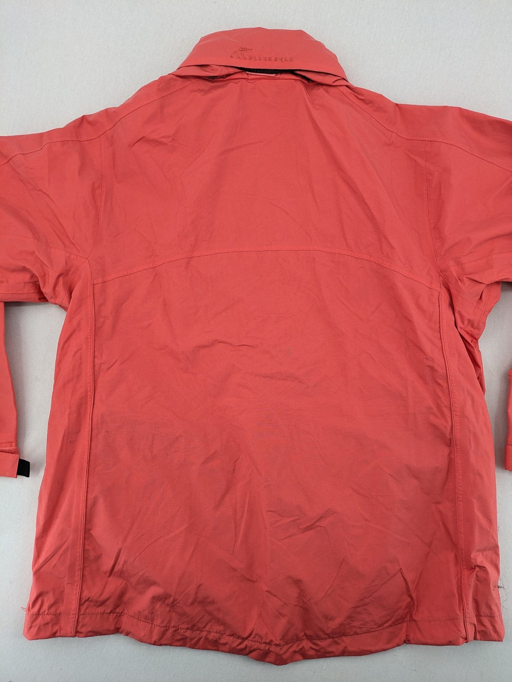Black Bear black rain jacket with coral pink mesh lining and full zipper.