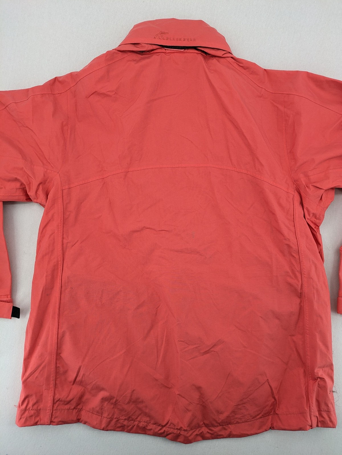 Black Bear black rain jacket with coral pink mesh lining and full zipper.