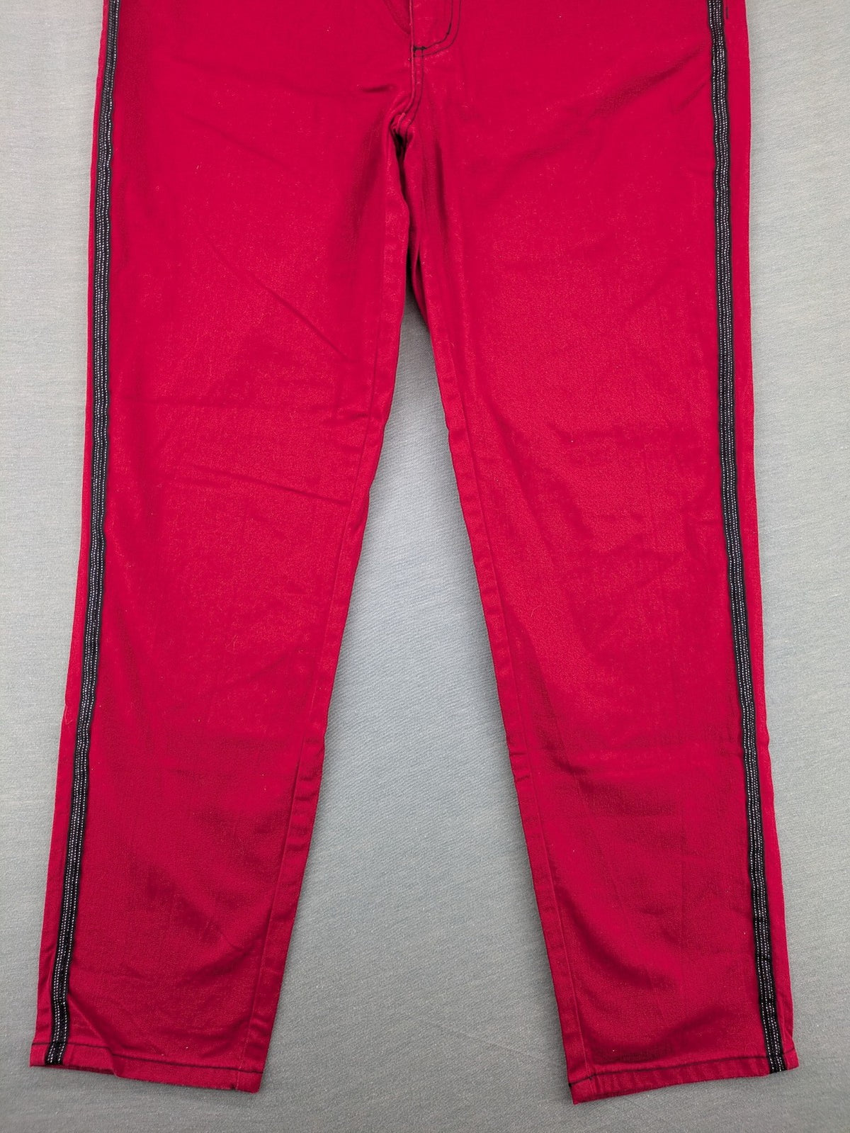 Ambria red straight jeans with black side stripe, classic five-pocket design, stretch cotton blend.