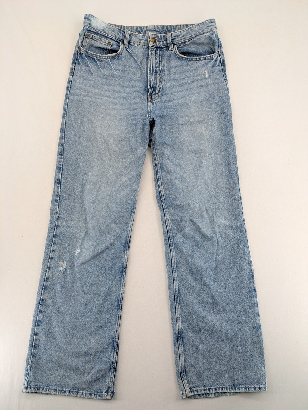 H&M blue wide leg jeans with distressed details and high waist, 100% cotton.
