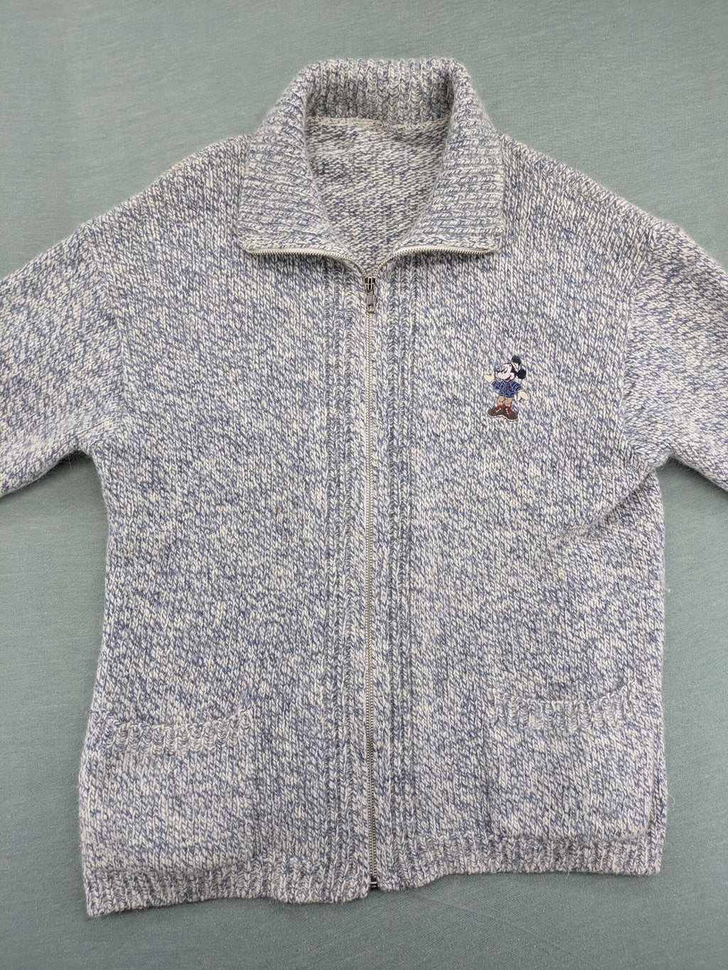 Disney blue turtle neck jumper with grey Mickey and Minnie Mouse embroidery, zip closure.