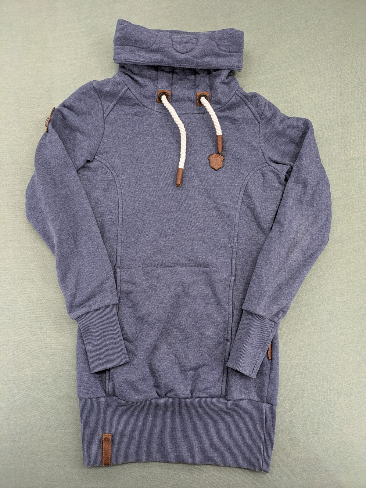Naketano grey turtle neck jumper with thick drawstring and leather logo appliqué.