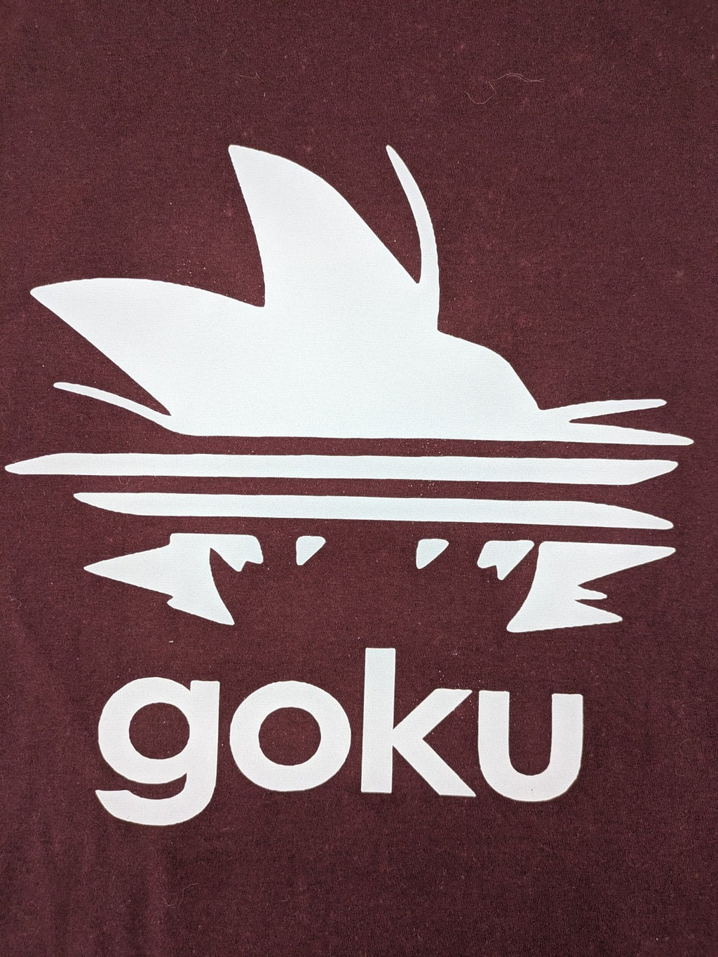 ADI band t-shirt burgundy with blue graphic parody of Adidas logo and Goku silhouette