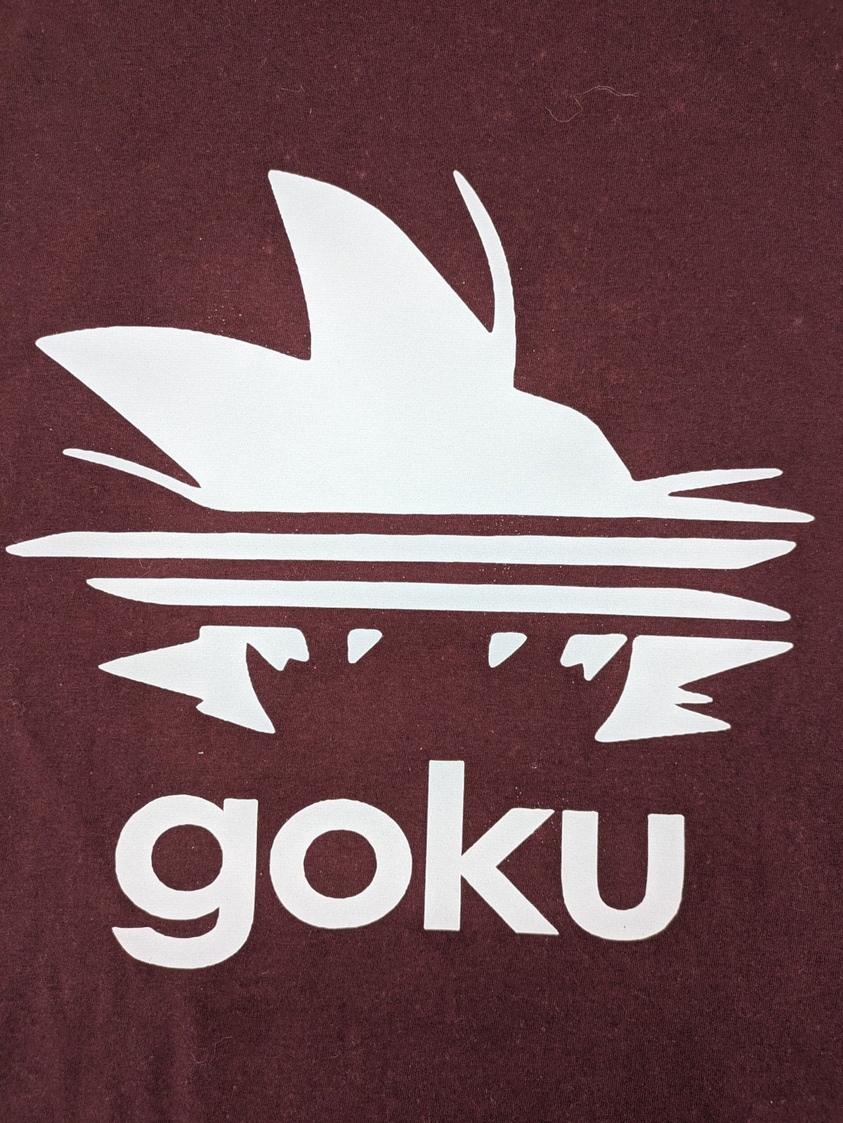 ADI band t-shirt burgundy with blue graphic parody of Adidas logo and Goku silhouette