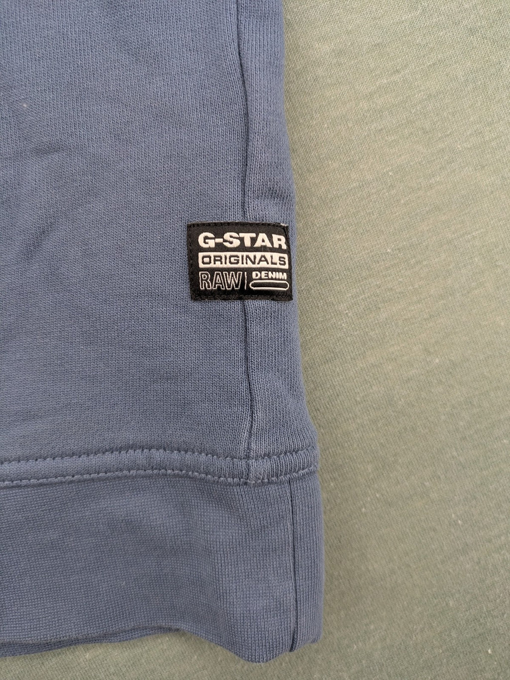 G-Star Raw blue turtle neck jumper with subtle logo on chest, made from organic cotton blend.