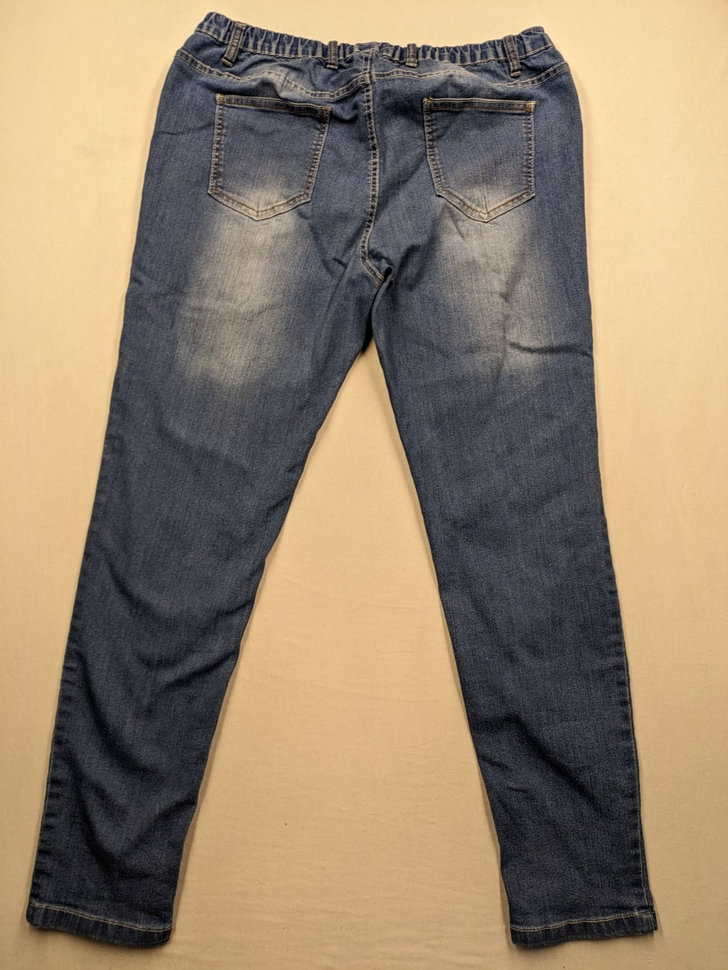 Rainbow blue straight jeans with elastic waistband and decorative knee stitching.