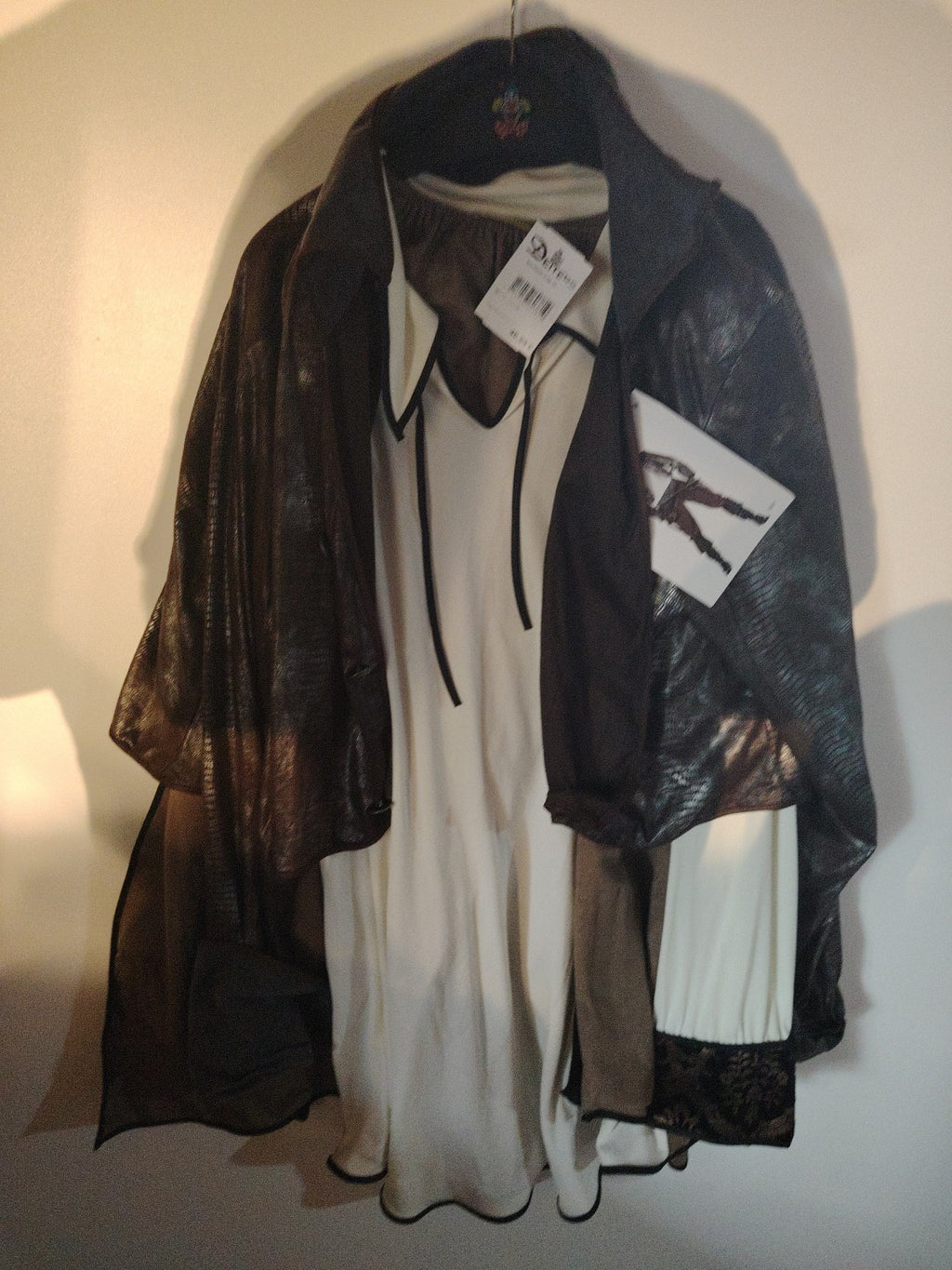 Wilbers brown pirate costume set with grey and white details, made of polyester.
