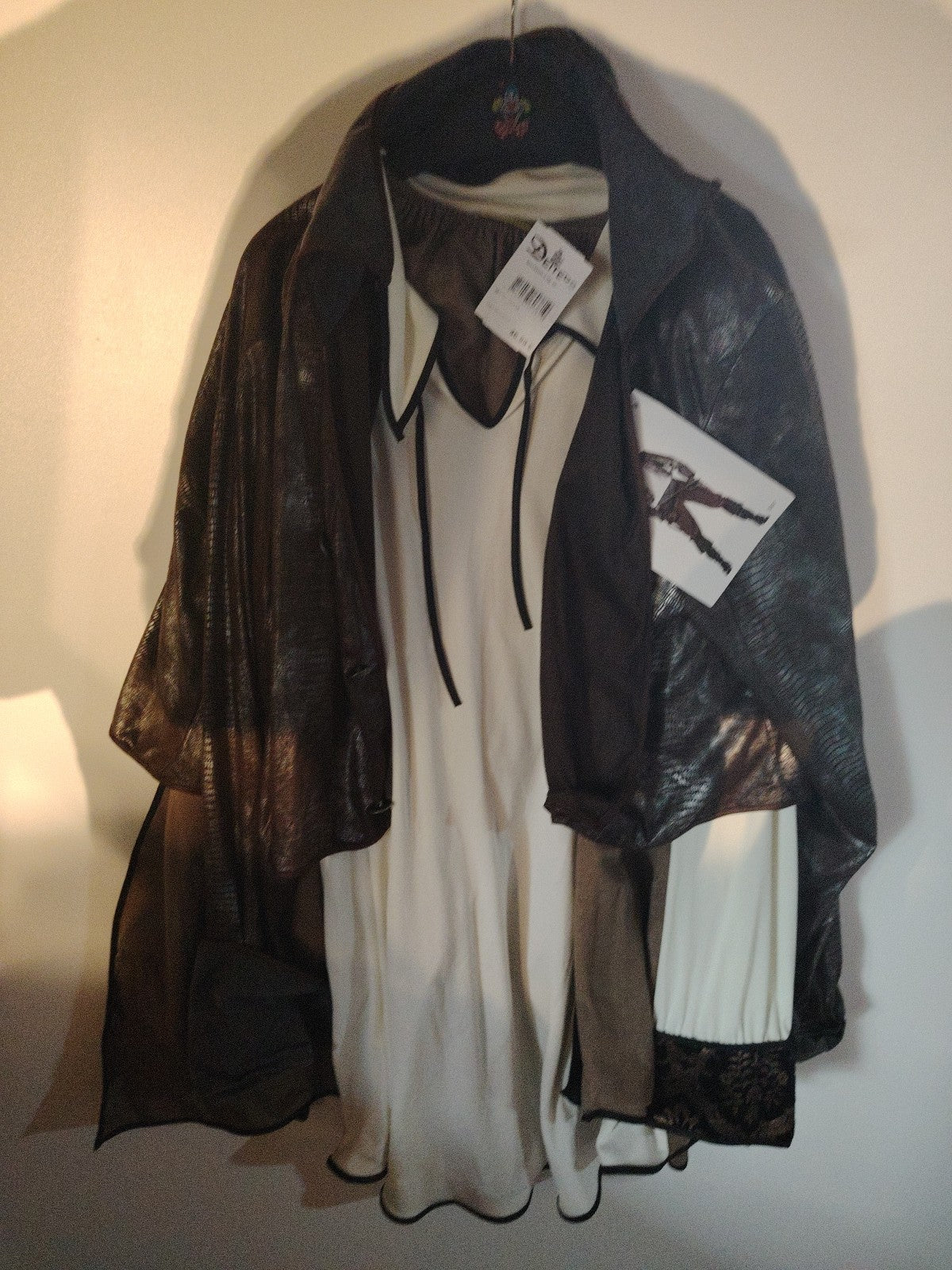 Wilbers brown pirate costume set with grey and white details, made of polyester.
