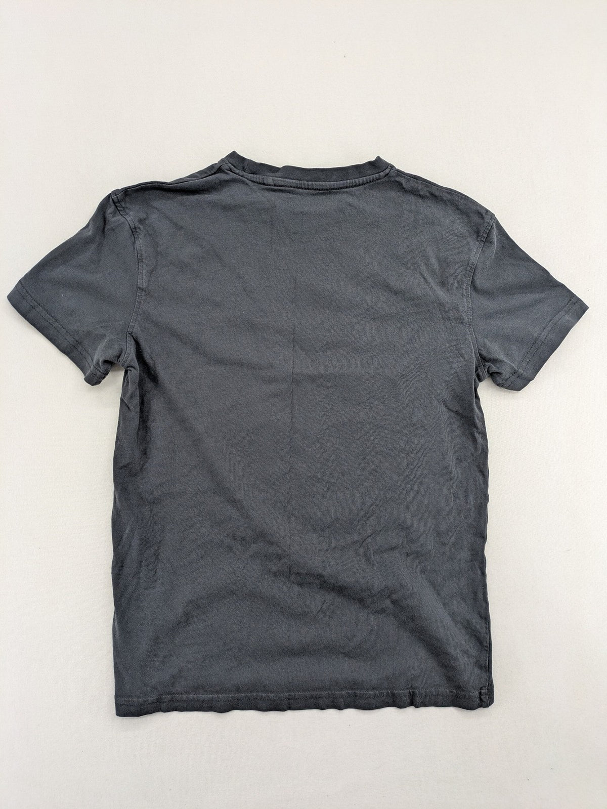 Harry Potter blue t-shirt featuring colorful Hogwarts crest and "I'd Rather Be At Hogwarts" slogan.