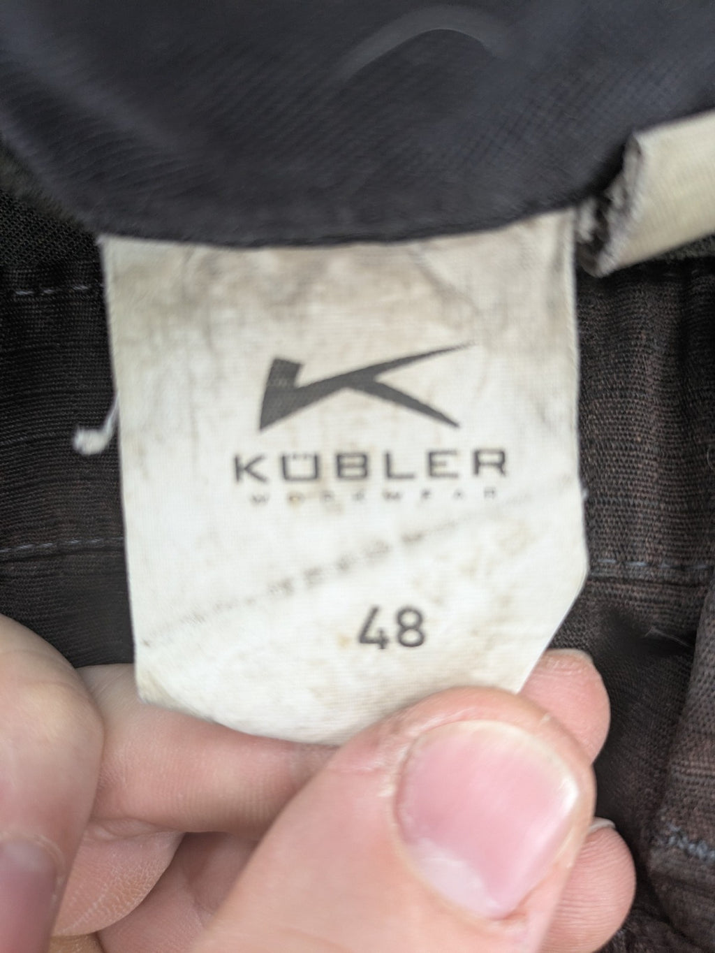 Kübler work pants blue grey Cordura fabric with multiple cargo pockets and reflective details.