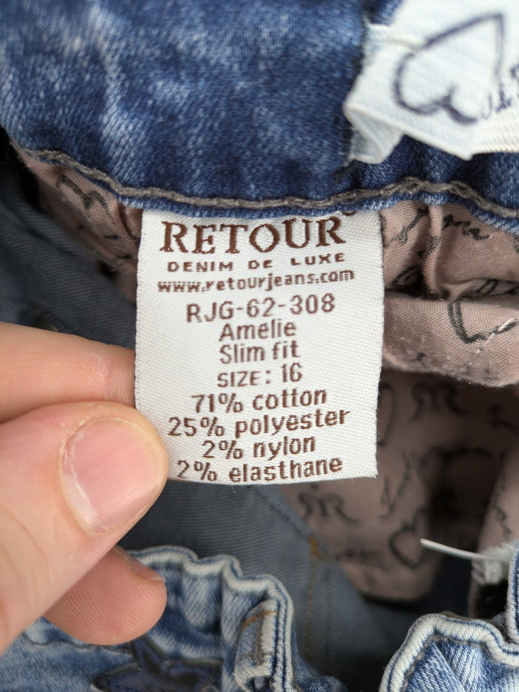 Retour blue slim fit jeans with classic 5-pocket style and adjustable waistband.