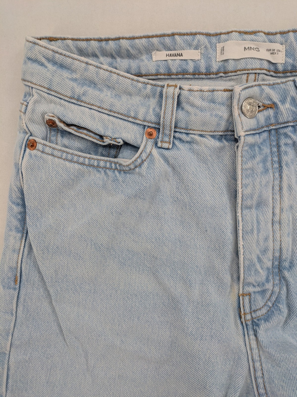 MNG blue high waist mom jeans with raw hem and five-pocket style.