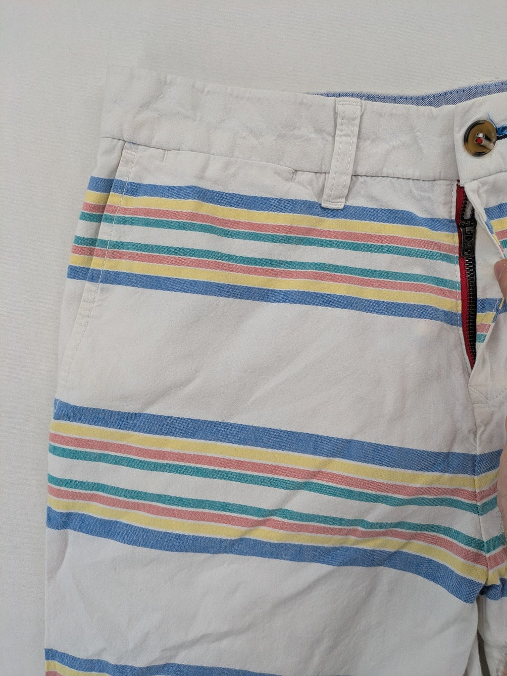 Tommy Hilfiger chino shorts blue and green striped pattern with iconic flag logo.