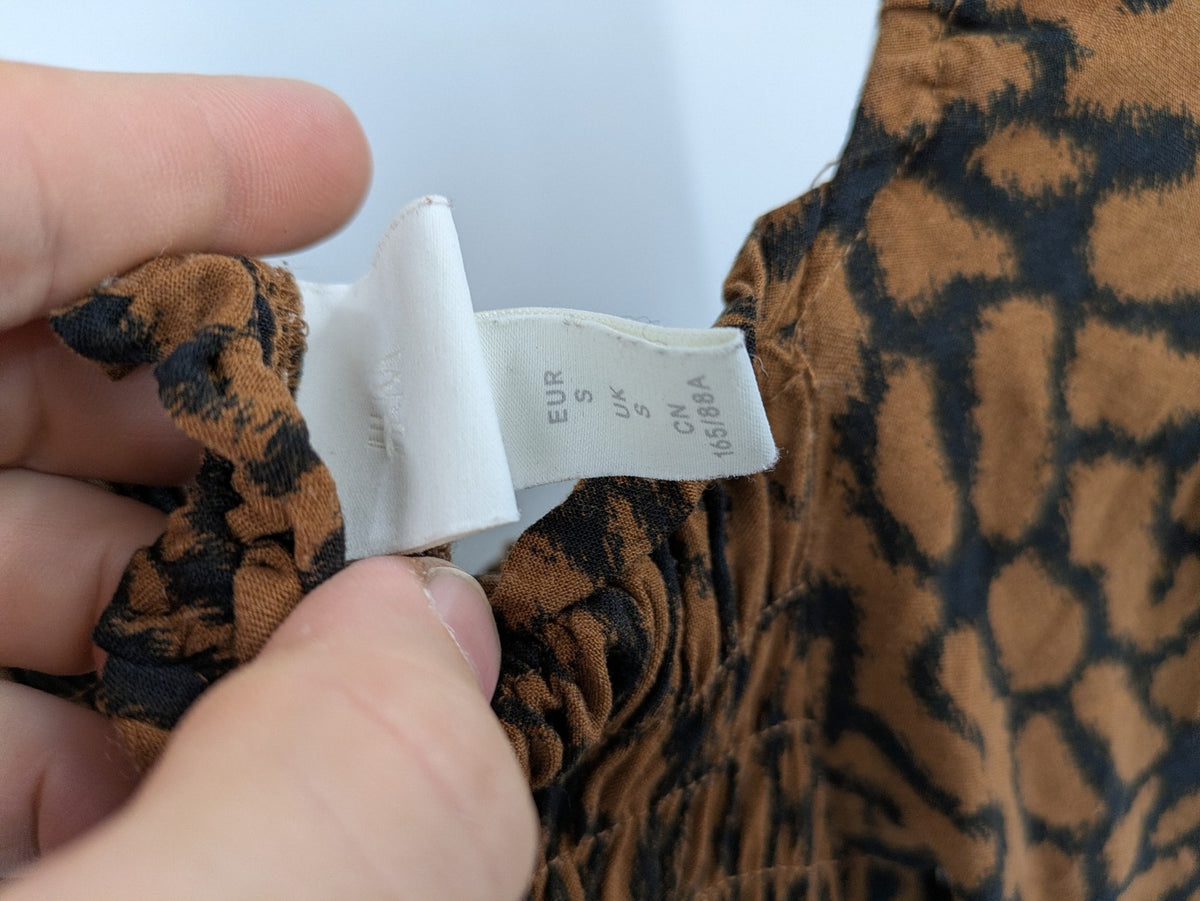 H&M brown and black animal print midi dress with smocked bodice and square neckline.