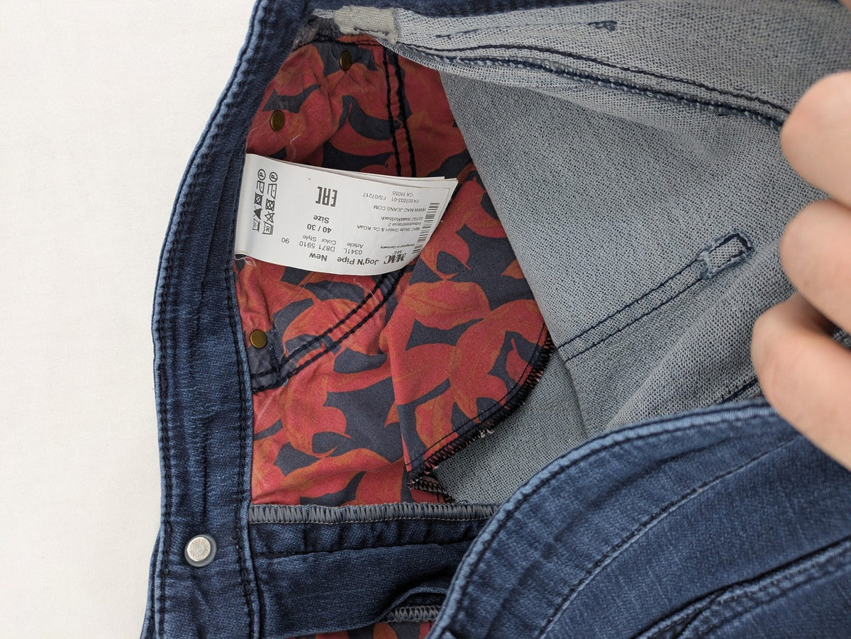 Mac Jeans blue slim fit straight jeans with light wash and stretch material.