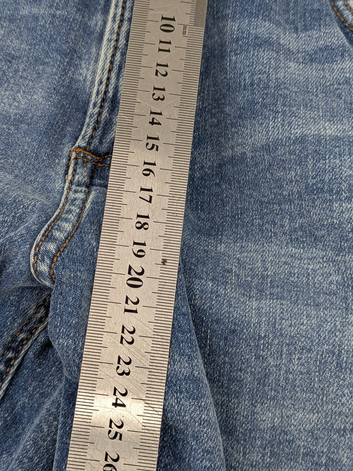 QS by s.Oliver green bootcut jeans with ankle zippers and classic denim wash.