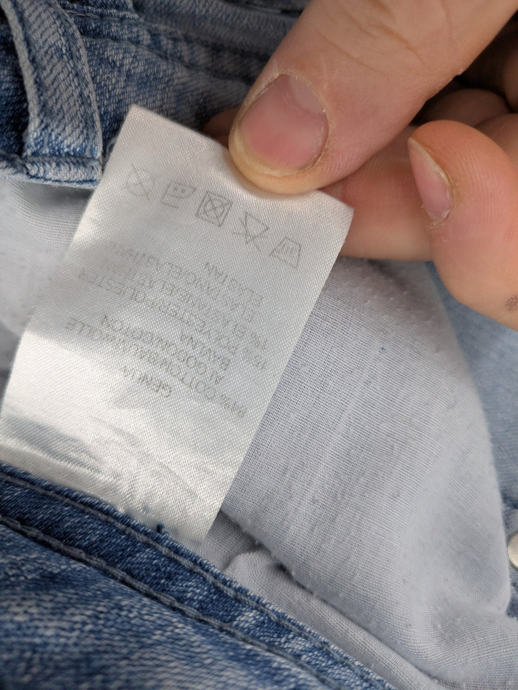 Capri blue straight jeans with 5-pocket design and embroidered details on back pockets.