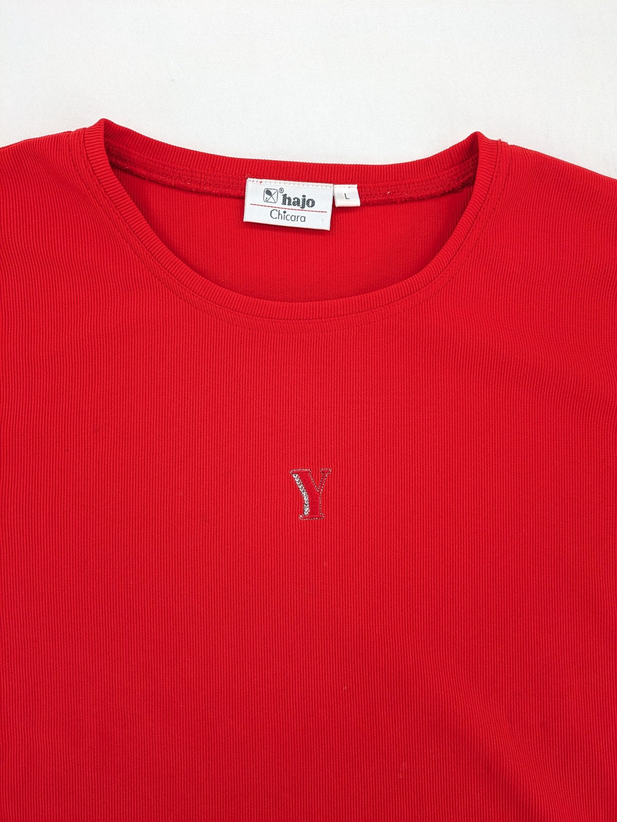 Hajo red t-shirt with ribbed texture and rhinestone Y-logo on chest.