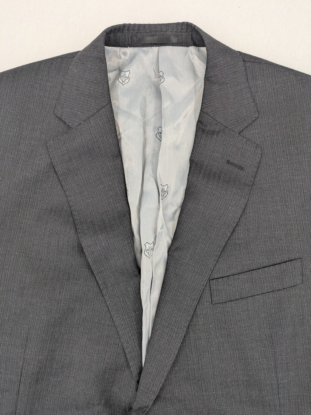 Desch grey blazer with dark grey pinstripe pattern, satin lining, and tailored design.