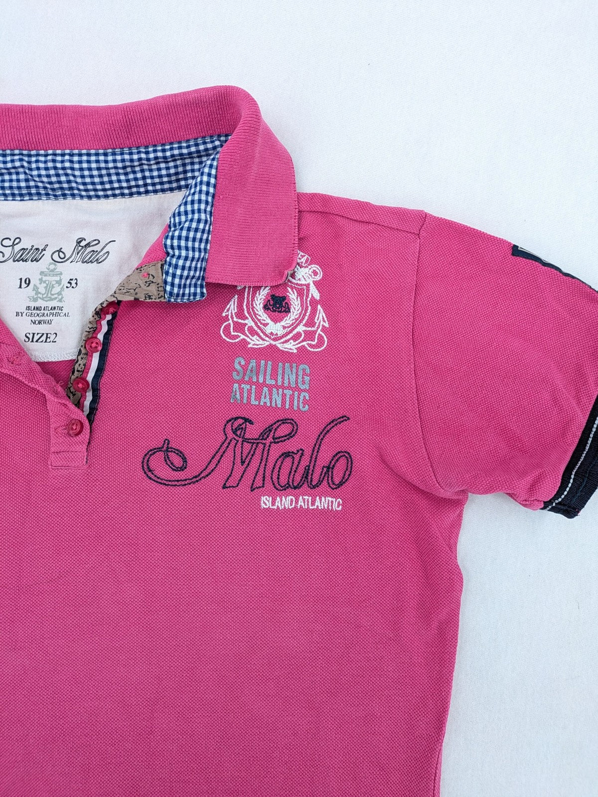 Geographical Norway pink polo shirt with embroidered Saint Malo design and Gingham trim.