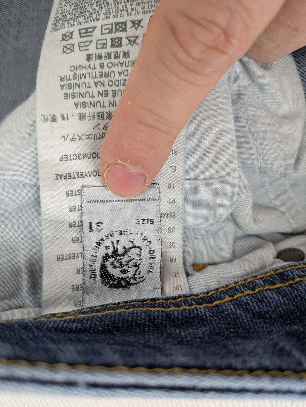 Diesel blue slim skinny jeans with logo patch and stretch denim material.