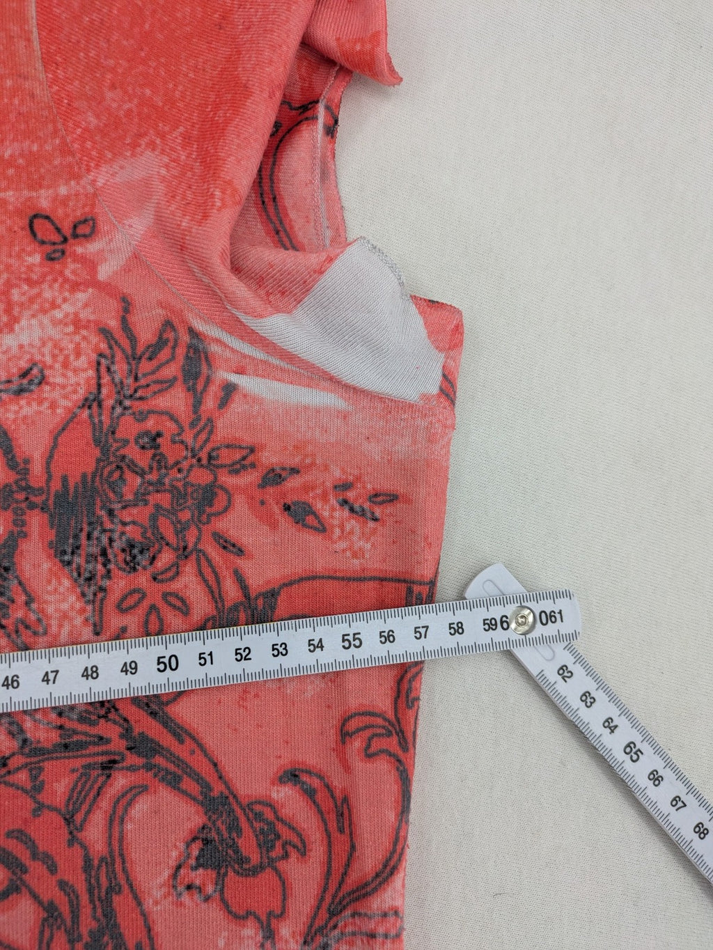 TREDY pink graphic top with rose and wings design, embellished with rhinestones.