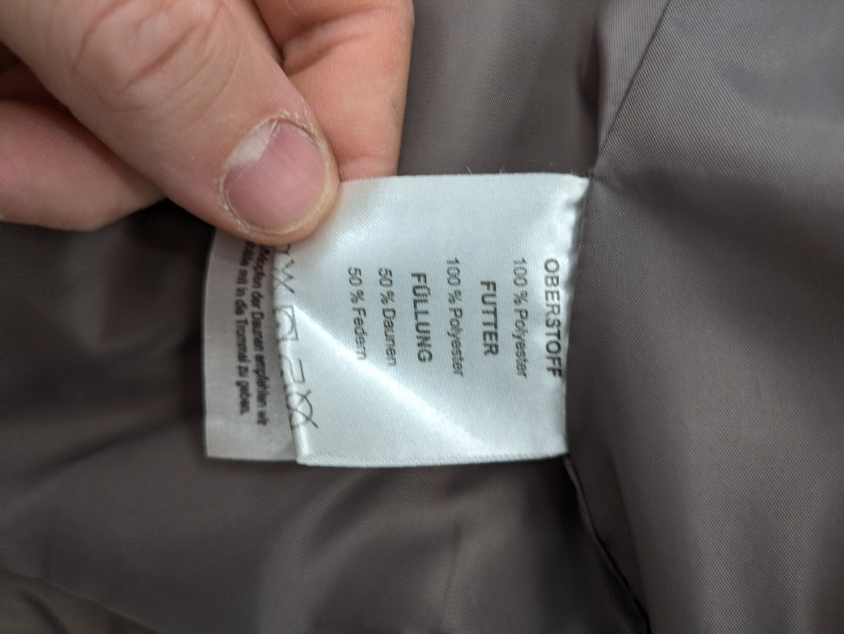 L&A Fashion grey puffer vest with zip closure, stand collar, and side pockets.