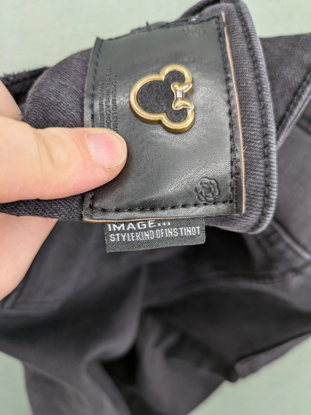 Disney black straight jeans with Minnie Mouse detail, cropped length, stretchy cotton blend.