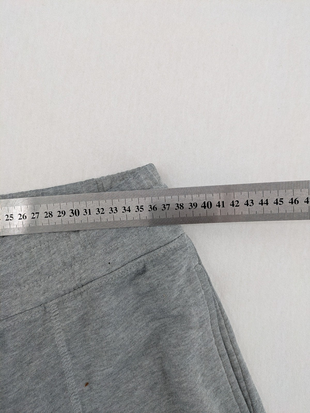Private Baller grey sweatpants with "32" graphic print and blue drawstring.